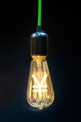 Money making idea. Light bulb with Japanese Yen symbol.