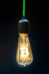 Money making idea. Light bulb with Bitcoin symbol.