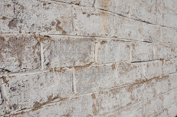 Wall background from white blocks with old texture.