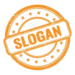 SLOGAN text on orange grungy vintage round stamp.
