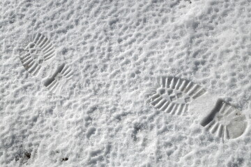 Fototapeta na wymiar Male footprints on the snow