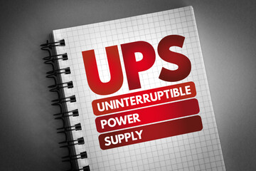 UPS - Uninterruptible Power Supply acronym on notepad, technology concept background