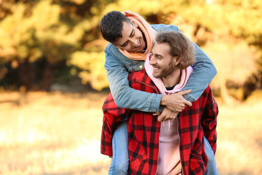 Happy Gay Couple In Autumn Park