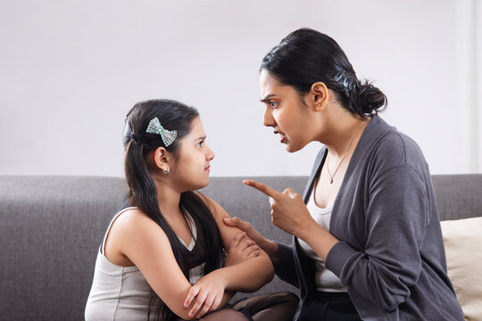 An Angry Mother Ruling Her Daughter By Pointing A Finger