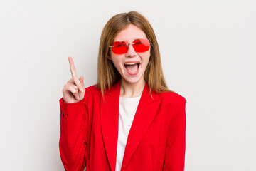 redhead pretty girl feeling like a happy and excited genius after realizing an idea