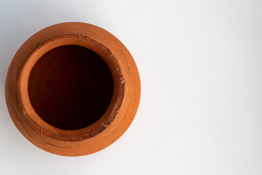 Clay pot shot flatlay on white background and copy space