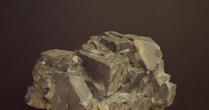 rotation of Crystal of galenite on black background