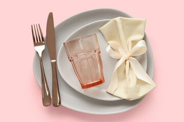 Simple table setting on beige background