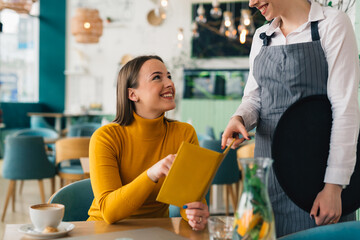 woman ordering food in restaurant