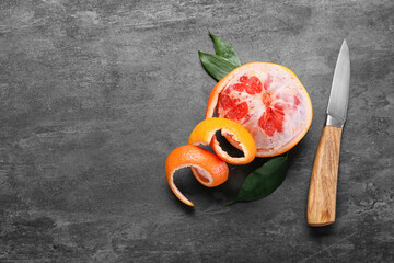 Fresh peeled grapefruit on dark background