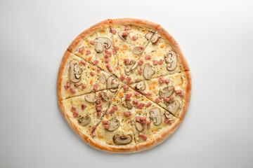Pizza with ham, mushrooms, oregano and cheese, on a white background