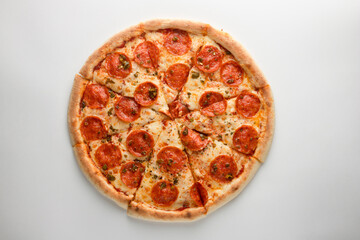 Pizza with pepperoni, jalapeno pepper and cheese, on a white background