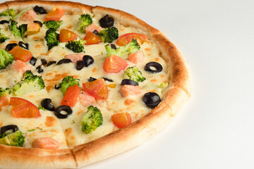 Pizza with olives, broccoli, tomatoes, red fish and cheese on a white background