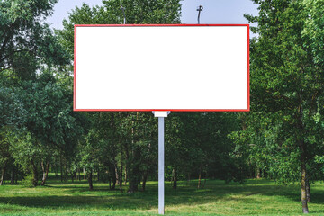 Blank billboard mockup with white screen. Against the backdrop of nature and blue sky. Business concept. Copy space banner for advertising.