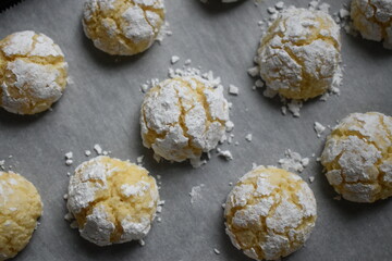 Baked almond coconut cookies are on the barking sheet.  Ghoriba Moroccan. Amaretti.