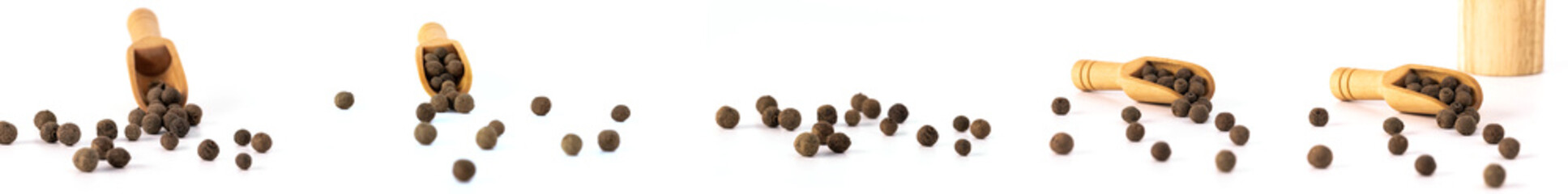 Black pepper. Wood spoon. Pepper mill. Light wooden pepper mill isolated on white background. Black pepper on table.