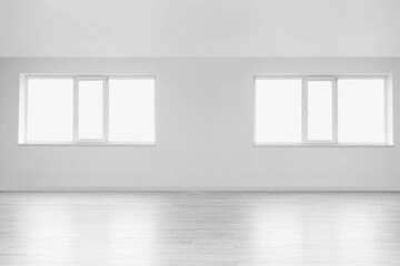 View of light wall with windows in big empty room