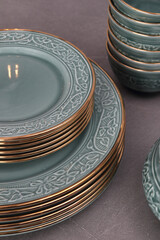 Crockery on a grey textured stone.