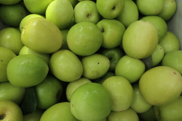 green food background of piles of fresh and delicious dates design for healthy lifestyle