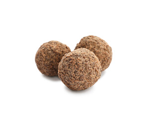 Delicious sweet chocolate truffles on white background