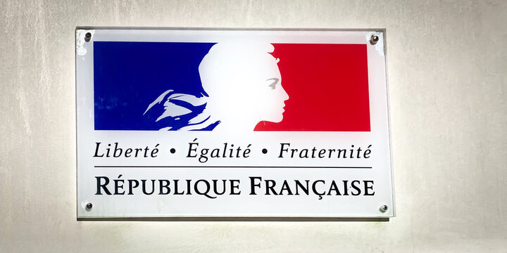 The French Republic sign with the French flag and the national motto of France "Liberty, Equality, Fraternity"