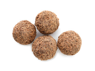 Delicious chocolate truffles on white background, top view