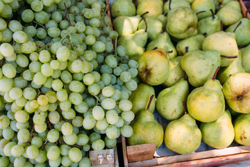 Fresh ripe fruits on the market in boxes