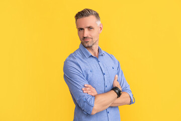 hair and beard care. male fashion model on yellow background. handsome guy with graying bristle.