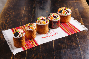 Traditional ukrainian easter Kulich cake (paskha) on a wooden desk on a towel