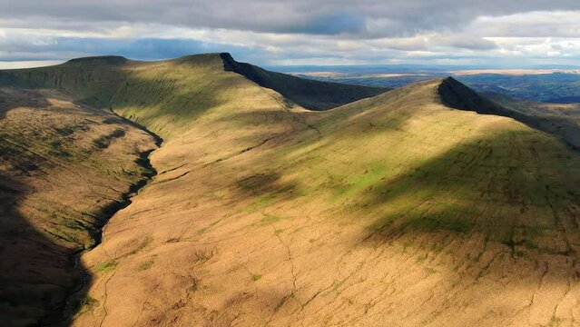 Aerial of Corn Du, Pen-y-Fan and Cribyn mountain peaks, Brecon Beacons National Park, Wales, United Kingdom
