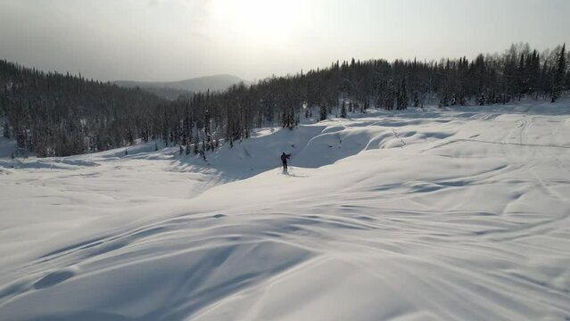 Lonely skier in winter mountains