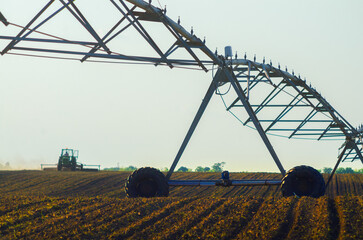 Modern irrigation system watering agricultural fields in summer.