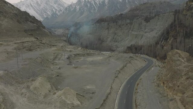 Panorama autumn scenery of sharp curve of blue turquoise stream of Hunza river along Karakorum highway in Hunza Nagar valley of Hunza, North of Pakistan