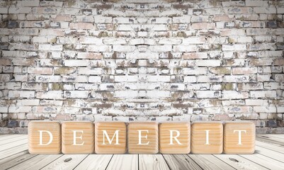 DEMERIT; Wooden blocks with text of concept.