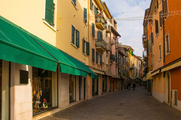 Fototapeta na wymiar A shopping street at Christmas in Garda town on the east shore of lake Garda, Verona Province, Veneto, north east Italy 