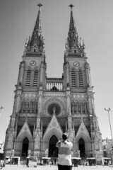 Fototapeta premium Basilica of Lujan, where the apostles are seen. Luján, Buenos Aires, Argentina. Black and white.