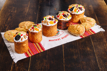 Traditional ukrainian easter Kulich cake (paskha) on a wooden desk on a towel