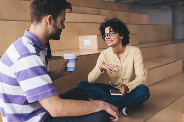 Man and woman resting in coworking office space