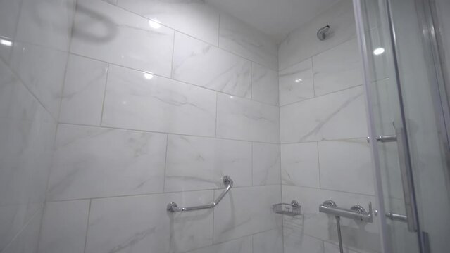 Modern bathroom, houses, a snapshot of the interior of real estate, home ownership. Bathroom design with shower. The interior of the apartment has a shower and toilet.