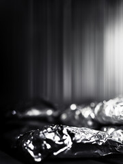 abstract background with metallic reflections, dark gradient and grain