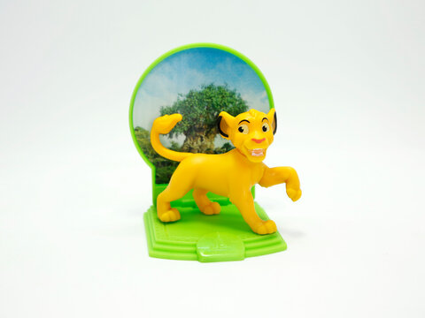 Simba. Character from the Disney movie The Lion King. McDonald's happy meal toy in commemoration of the Walt Disney World 50th Anniversary celebration. Plastic figure. Isolated white. Animal. Lion cub