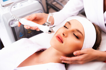 Photo of the procedure of non-injection oxygen mesotherapy of the face. The concept of aesthetic...