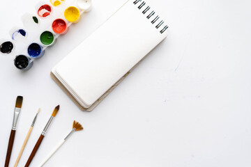 Flat composition set of artistic tools. Brushes, paints, pencils, pastels for drawing. Place for text.