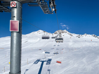  ride in the chairlift over white slopes in the deserted ski area