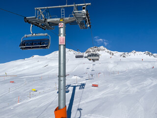  ride in the chairlift over white slopes in the deserted ski area