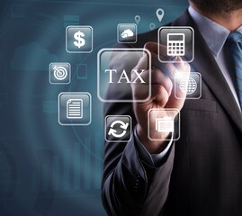 Business hand clicks virtual screen to tax return online, income tax, and property tax.