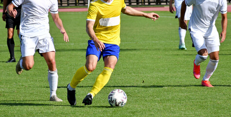 Obraz premium Soccer players in action summer time