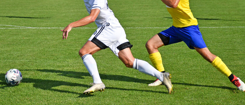 Soccer players in action summer time