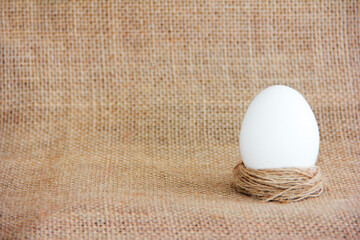 festive white easter egg on a baggy fabric