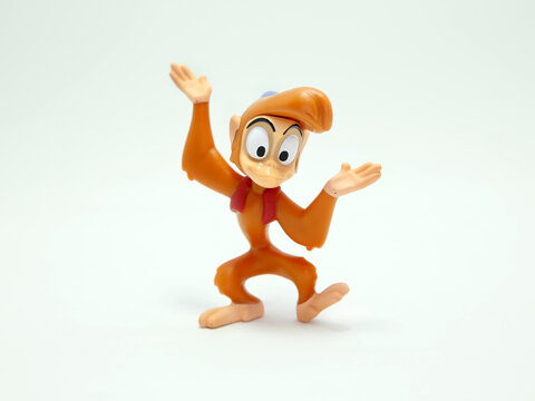 Aladdin. Abu. Abú, kleptomaniac monkey from the Walt Disney movie Alladin. McDonald's happy meal toys in commemoration of the Walt Disney World 50th Anniversary celebration. Plastics figures. Isolated